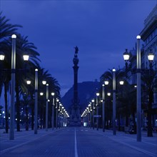 Overview of Paseo Colon in Barcelona at night.