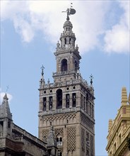 Giralda Tower in Seville, two-thirds are from 12th century in Almohad style and the top was finis?
