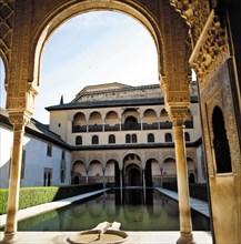 View of the south side of the Myrtles courtyard at the Alhambra in Granada.