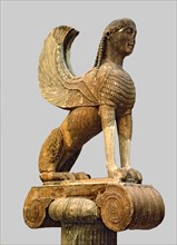 Sphinx of Naxos resting on an Ionic capital, from Delphi.
