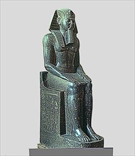 Seated statue of Ramses II, made in diorite, side view, it comes from Tanis.