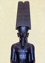 Statue of the god Amon protecting Tutankhamen, made in black granite, 1350 b.C, detail of the top?