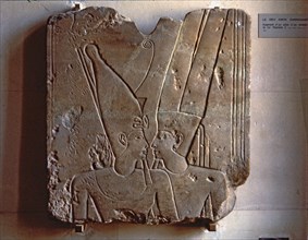 Relief of the god Amun hugging Ramses II, made in stoneware, fragment from Karnak.