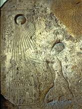 Stela depicting Akhenaten, Nefertiti and their daughters adoring Aton, made in limestone.