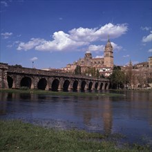 Salamanca. View of the Roman bridge over the river Tormes with the cathedral in the background.