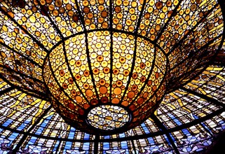 Detail of the Modernist stained glass window in the roof of the Palau de la Música Catalana in Ba?