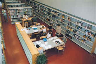 Young people studying inside the Public Library Mercè Rodoreda in Horta-Guinardó, Barcelona.