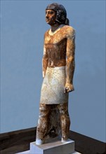 Funerary statue of Nenkheftka, made in polychromed limestone.