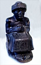 Seated statue of Gudea, prince of Lagash city', one of many Sculptures dedicated to this ruler wh?