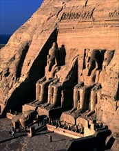 Façade of the Great Temple of Ramses II at Abu Simbel. It has four seated colossi of Ramses II an?