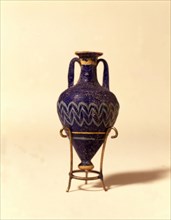 Dark blue glass jar - amphora with light blue and yellow ornamentation. Not blowed glass, from Em?