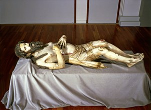 Christ lying in a St. Sepulchre, made in 1350 in alabaster, preserved in the church of Sant Feliu?