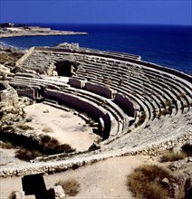 View of the amphitheater of Tarragona, the sea in background.