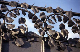 Detail of wrought iron with floral motifs of the old Modernist textile factory Casaramona's gate,?