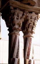 Detail of two capitals with carved figures with allegorical and religious decoration, and columns?