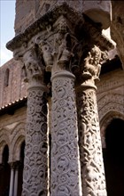Capitals and carved columns in the Monreale Cathedral cloister in Sicily. The cathedral is Norman?