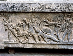 Etruscan stone sarcophagus with reliefs of Eastern influence, with scenes of hunting and battle.