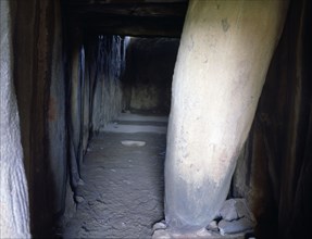 Soto dolmen, cave built in stone, view of the corridor with the chamber at the bottom.