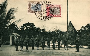Postcard. St. Elizabeth of Fernando Poo. Flag hoisting by the colonial guard at the Assobla post,?