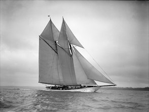 The 250 ton schooner 'Germania' sails close-hauled, 1911. Creator: Kirk & Sons of Cowes.
