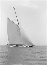 America's Cup challenger 'Shamrock IV' sailing without topsail, 1914. Creator: Kirk & Sons of Cowes.