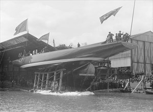 The launch of 'Shamrock IV' at Gosport, May 1914. Creator: Kirk & Sons of Cowes.