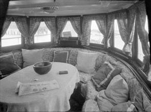 Cruising in comfort, the saloon of motor yacht 'Scaramouche', 1927. Creator: Kirk & Sons of Cowes.
