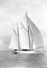 The 105 ft ketch 'Thendara' sailing with spinnaker. 1939. Creator: Kirk & Sons of Cowes.