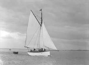 The gaff rig sailboat 'Bunty' close-hauled, 1921. Creator: Kirk & Sons of Cowes.