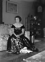 Portrait of seated woman in evening dress, (Isle of Wight?), c1935.  Creator: Kirk & Sons of Cowes.