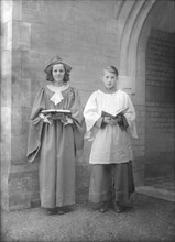 Girl and boy chorister, (Isle of Wight?), c1935. Creator: Kirk & Sons of Cowes.