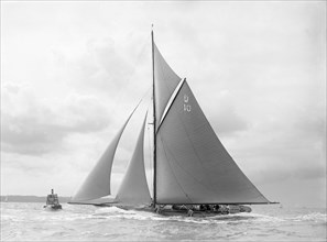 'The Lady Anne' spray over deck, sailing close-hauled, 1912. Creator: Kirk & Sons of Cowes.