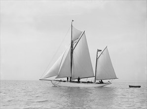 The yawl 'Meander' sailing in fine conditions, 1913. Creator: Kirk & Sons of Cowes.