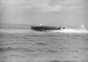 The hydroplane 'Izme' under way, 1913. Creator: Kirk & Sons of Cowes.