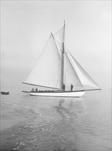 The cutter 'Wenda' in light winds, 1912. Creator: Kirk & Sons of Cowes.