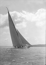 The 23-metre cutter 'Astra' sailing close-hauled, 1931. Creator: Kirk & Sons of Cowes.
