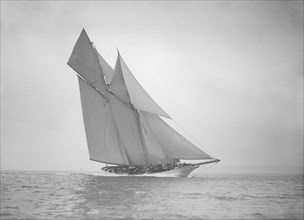 The beautiful schooner 'Cetonia' making good headway, 1911. Creator: Kirk & Sons of Cowes.