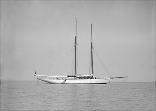 The schooner 'Joyance' at anchor, 1913. Creator: Kirk & Sons of Cowes.