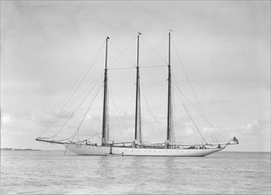 The American three mast schooner 'Karina' at anchor, 1912. Creator: Kirk & Sons of Cowes.
