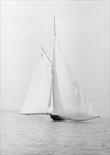 The 15 Metre sailing yacht 'Pamela' searching for wind, 1913. Creator: Kirk & Sons of Cowes.