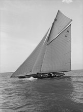 The 8 Metre 'Ventana' (H11) sailing close-hauled, 1914. Creator: Kirk & Sons of Cowes.