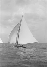 The 7 Metre yacht Strathendrick (K5) sailing with spinnaker, 1914. Creator: Kirk & Sons of Cowes.