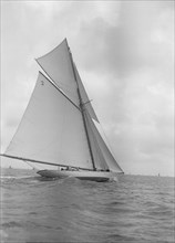 The 40-rater cutter 'Carina' sailing close-hauled, 1911. Creator: Kirk & Sons of Cowes.