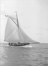 The cutter 'Nereid' sailing close-hauled, 1912. Creator: Kirk & Sons of Cowes.