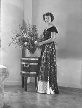 Portrait of woman in evening dress, (Isle of Wight?), c1935.  Creator: Kirk & Sons of Cowes.