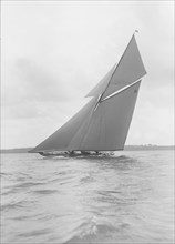 The gaff rigged 15 Metre yacht 'Paula III' sailing close-hauled, 1915. Creator: Kirk & Sons of Cowes.