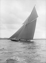The 15 Metre sailing yacht 'Pamela' sailing close-hauled, 1913. Creator: Kirk & Sons of Cowes.