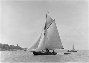 The 9 ton auxilary cutter 'Grayling', 1921. Creator: Kirk & Sons of Cowes.