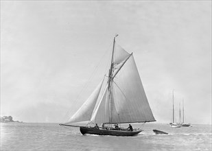 The 9 ton auxilary cutter 'Grayling', 1921. Creator: Kirk & Sons of Cowes.
