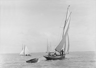 The 9 ton auxilary cutter 'Grayling' with  tender, 1921. Creator: Kirk & Sons of Cowes.